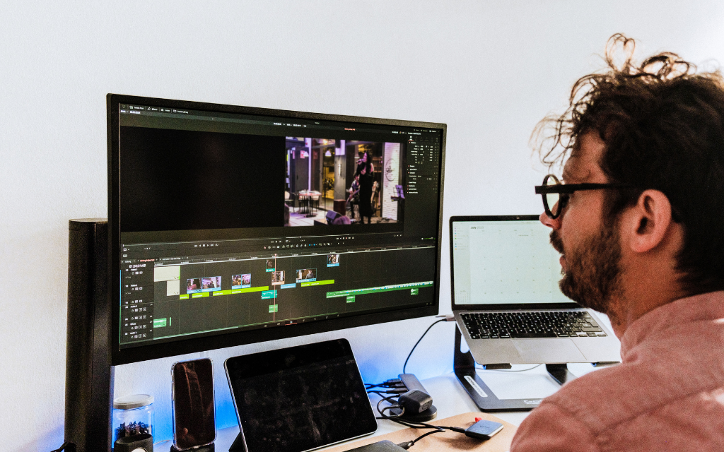 a man editing video on the desktop